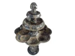 A beautifully crafted brown marble fountain from Erfoud, Morocco, embedded with fossilized orthoceras, showcasing intricate fossil patterns and expert craftsmanship.